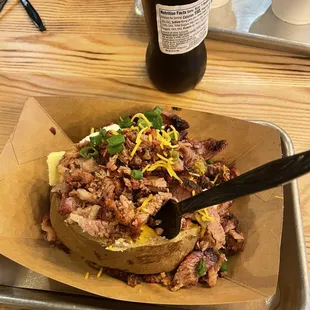 a plate of food and a bottle of coke