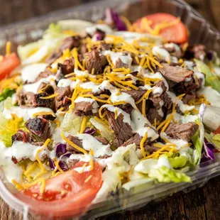 a salad in a plastic container