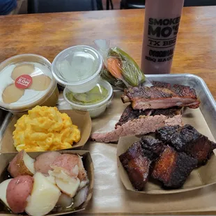 2 meat plate with 1/4 lb pork belly burnt ends, 1/4 lb ribs, mac n cheese and buttered potatoes along with banana pudding for dessert
