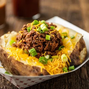 a closeup of a loaded baked potato