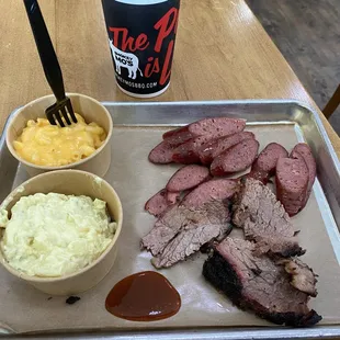 Brisket with jalapeño sausage, mac &amp; cheese and potato salad.