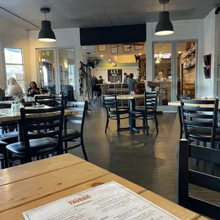 Smokey Oaks Tavern dining room with bar in the background