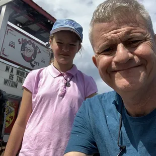 A picture of us in front of the restaurant that won the award of worst meal I have ever had.