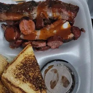 Brisket and sausage plate with beans and potato salad