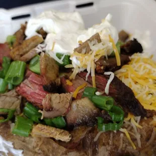 Sliced brisket loaded baked potato! (we added extra meat in this photo)