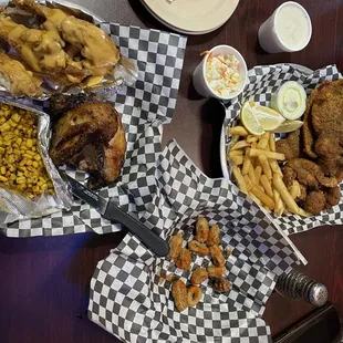 Calamari, seafood platter, and 2 meat combo with wings in campfire sauce and rotisserie chicken