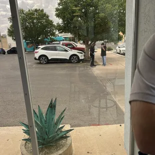 The cook snaking with gloves on.