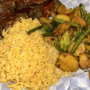 Jerk chicken with mixed veggies and yellow rice