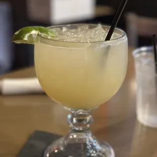 a drink in a glass on a table