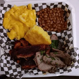 Hot link, baby backs, tri tip with chimichurri, beans, mac &amp; cheese, and cornbread. Delicious!