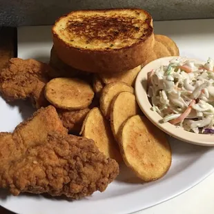 Fish with homemade chips coleslaw and garlic toast