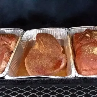 three loafs of meat in foil pans