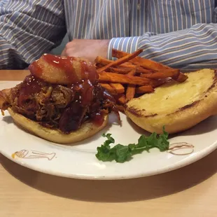 Pulled pork sandwich with sweet potato fries.