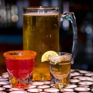 a pitcher of beer and a shot of tequila