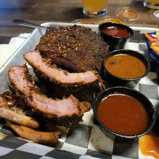 Better view of the ribs showing not a lot of juices and too thick layer of rub.