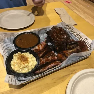 1/2 pound Brisket, ribs, chicken. Side of mac and cheese and backed beans