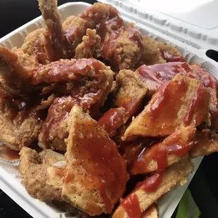 a tray of fried chicken with ketchup