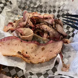 a fork in a basket of meat