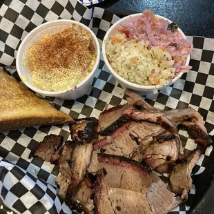 Thick sliced brisket with tater salad and Cole slaw half atomic half regular.