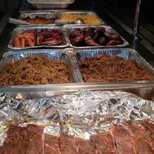 Ribs, Pulled Pork, Brisket, Hotdogs, Brats, Chicken, Cheesy potatoes, Mac n cheese and coleslaw