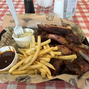 Small pork rib tips with fries and slaw  Super yummy!  Friendly service  Will be back soon