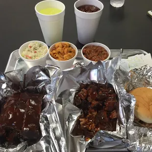 Meat trio and s pulled pork sandwich. Slaw, beans and mac n cheese. All awesome!