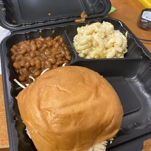 Clumpy water n cheese with stale bun on sandwich and canned beans