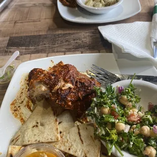 1/4 rotisserie chicken with tandoori sauce. sides were tabhouli and classic hummus. Other plate bbq pulled chicken with Mac n cheese.
