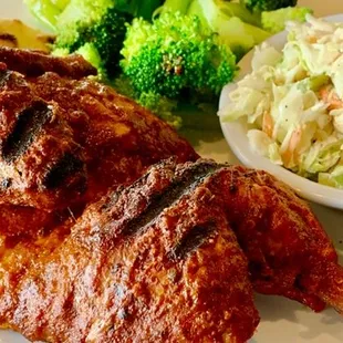 Half chicken with cole slaw and broccoli