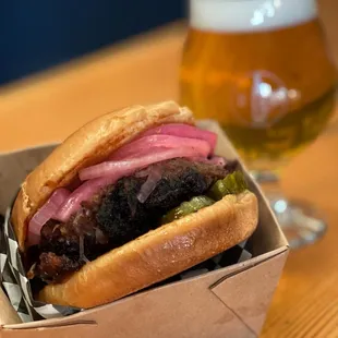 a burger and a glass of beer