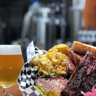 a plate of food and a glass of beer