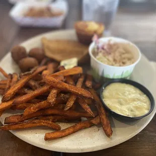 plate of sweet potato fries with a side of cole slaw
