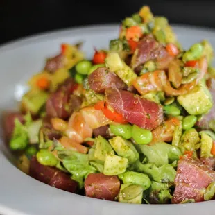 a white plate with a salad on it