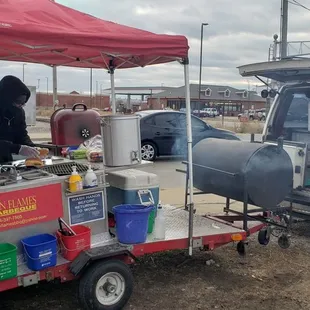 a man selling food from a trailer