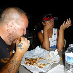  man and a woman eating