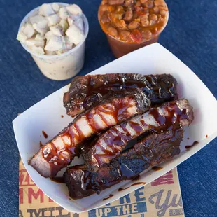 a plate of ribs and sides