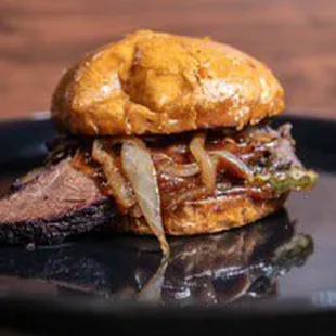 The Texan with bourbon onions.  12 hour hickory smoked brisket, bourbon onions, bbq sauce, brioche bun