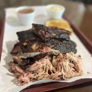 Trio of meats and 2 sides