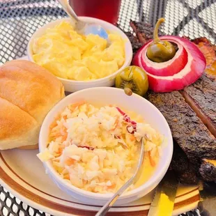  plate of ribs, coleslaw, coleslaw, pickles, and