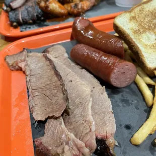 Brisket (I had asked for fatty slices), Polish Sausage, Ribs, Wings, Fries, baked beans, potato salad, coleslaw