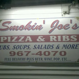 sign for pizza and ribs