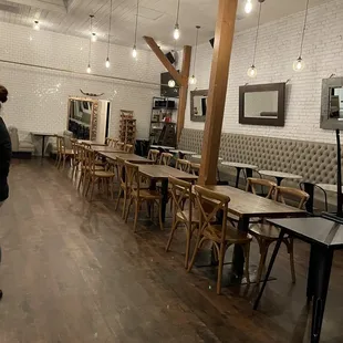 a woman walking through a restaurant