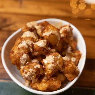 a bowl of fried tater tots