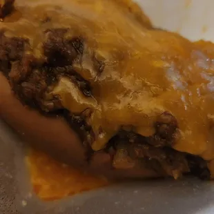  hot dog covered in cheese