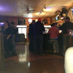 eople sitting at the bar