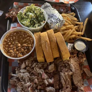 Smokin J's feast with baked beans and broccoli salad, also got 1 order of fries and baked potato instead of 2 fries.