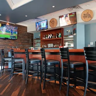  bar with black leather chairs