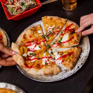 Hand-tossed pizzas made with never-frozen ingredients.