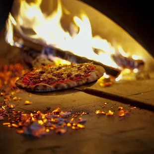 a pizza being cooked