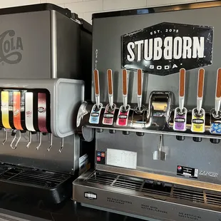  a beer dispenser and a soda dispenser